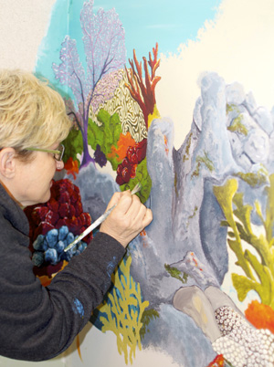 Cook is completing a mural inside Marathon's hospital, alongside four other area artists.